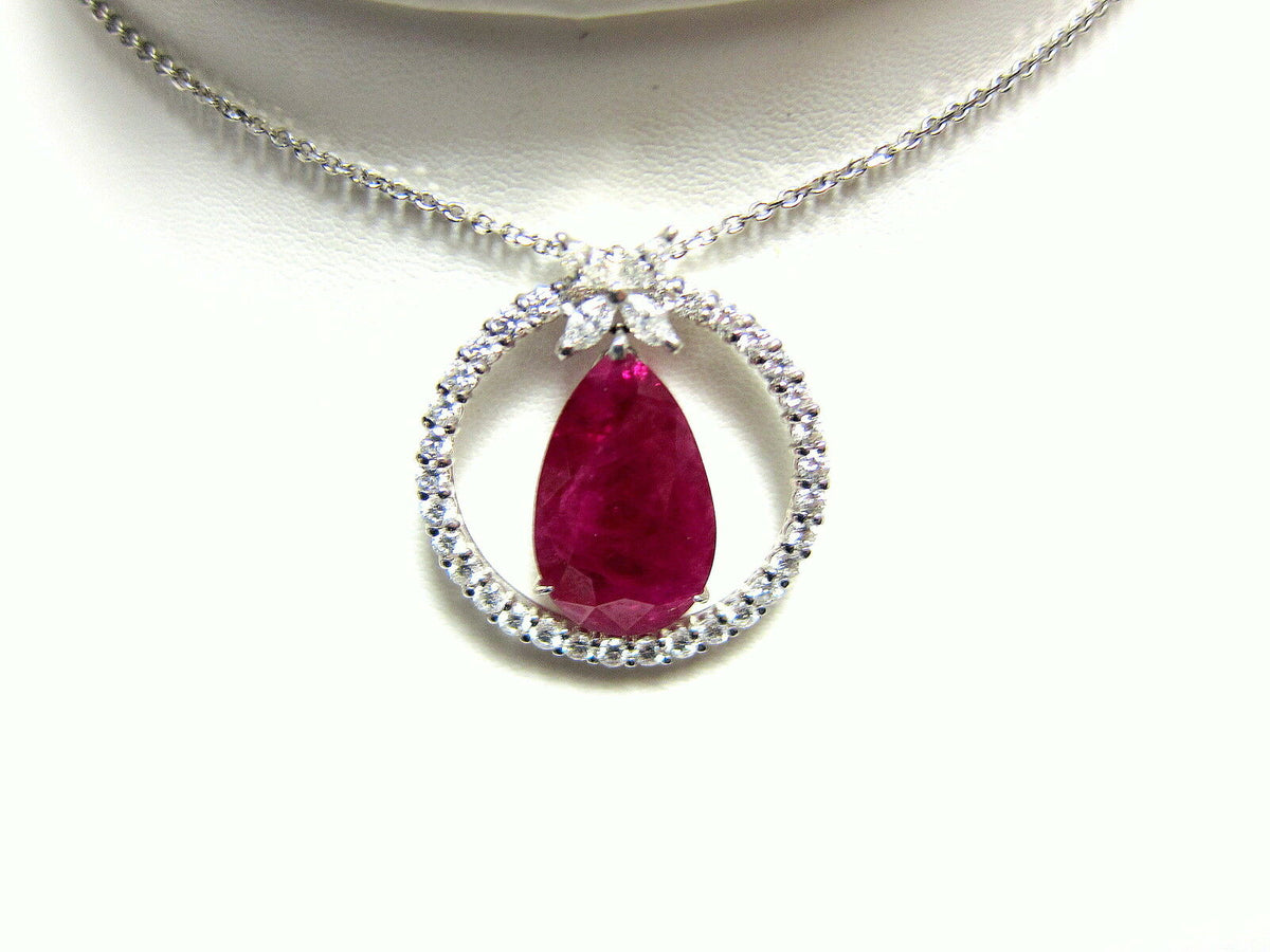 RUBY PEAR SHAPE PENDANT SET WITH ROUND DIAMOND FOUR MARQUISE SHAPE SET AROUND