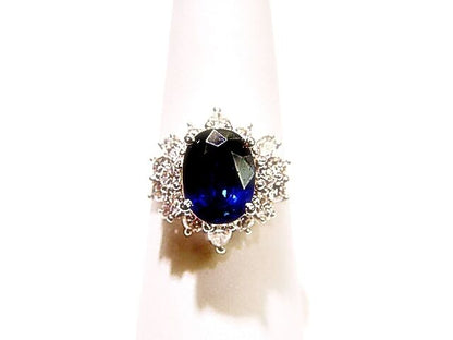 OVAL BLUE SAPPHIRE SET WITH ROUND BRILLIANT MARQUISE