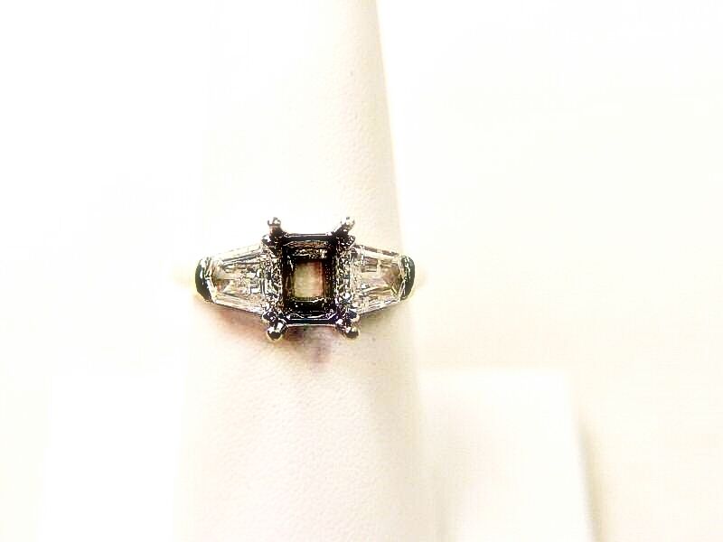 PLATINUM SETTING AND 2 NATURAL SHEILD CUT DIAMOND