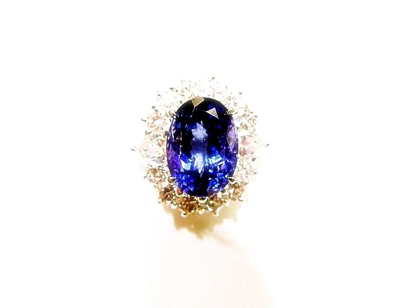 3.78 CT TANZANITE OVAL OVAL CUT SET WITH 12 ROUND BRILLIANT CUT DIAMONDS 18 K