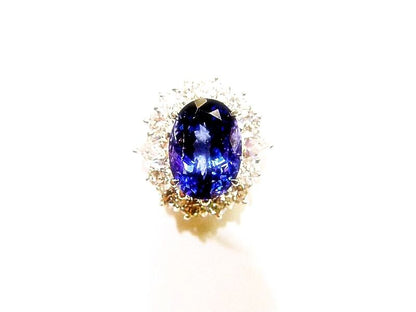 3.78 CT TANZANITE OVAL OVAL CUT SET WITH 12 ROUND BRILLIANT CUT DIAMONDS 18 K