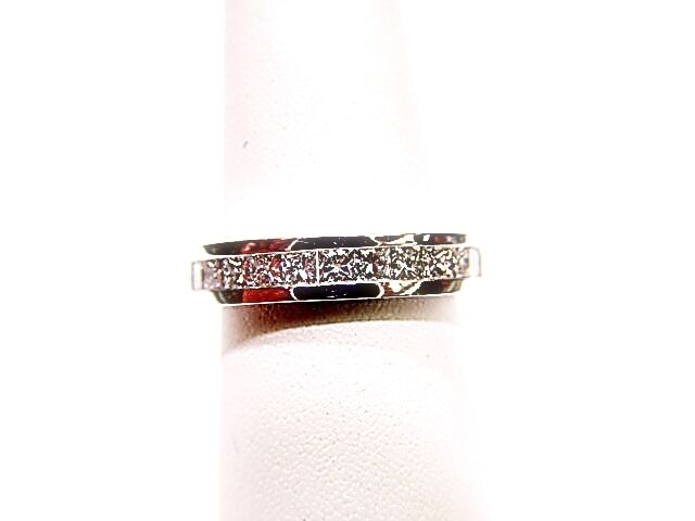 DIAMONDS ARE CHANNEL SET ALL THE WAY AROUND THE BAND