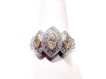 3 MARQUISE CUT DIAMONDS WITH ROUND BRILLIANT CUT DIAMONDS TOP SET RING PLATINUM