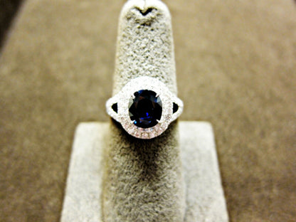 OVAL DEEP BLUE SAPPHIRE ROUND BRILLIANT PRONG SET DIAMOND