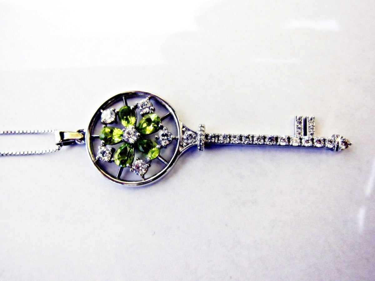 PERIDOT PEAR SHAPE AND DIAMOND ROUND BRILLIANT KEY PENDANT