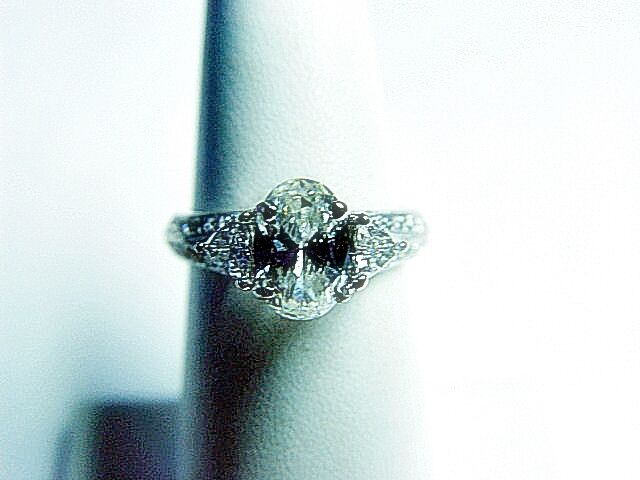 CERTIFIED DIAMOND OVAL SHAPE 8.42X5.70X3.81MM 2 TRILLION ROUND ENGAGEMENT RING