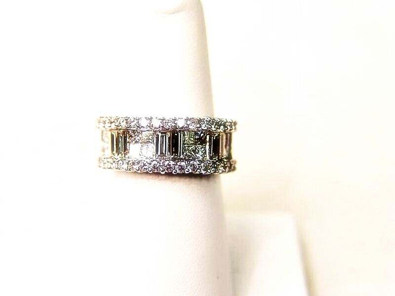 34 ROUND BRILLIANT CUT PRONG SET 16 PRINCESS CUT AND 6 BAGUETTE CUT INVISIBLE