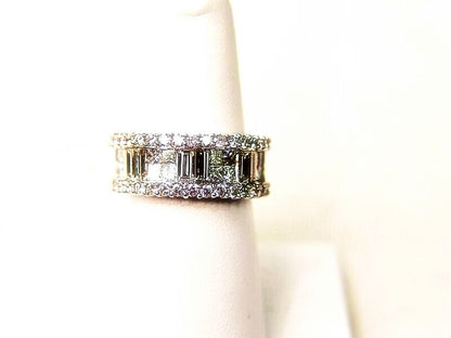 34 ROUND BRILLIANT CUT PRONG SET 16 PRINCESS CUT AND 6 BAGUETTE CUT INVISIBLE