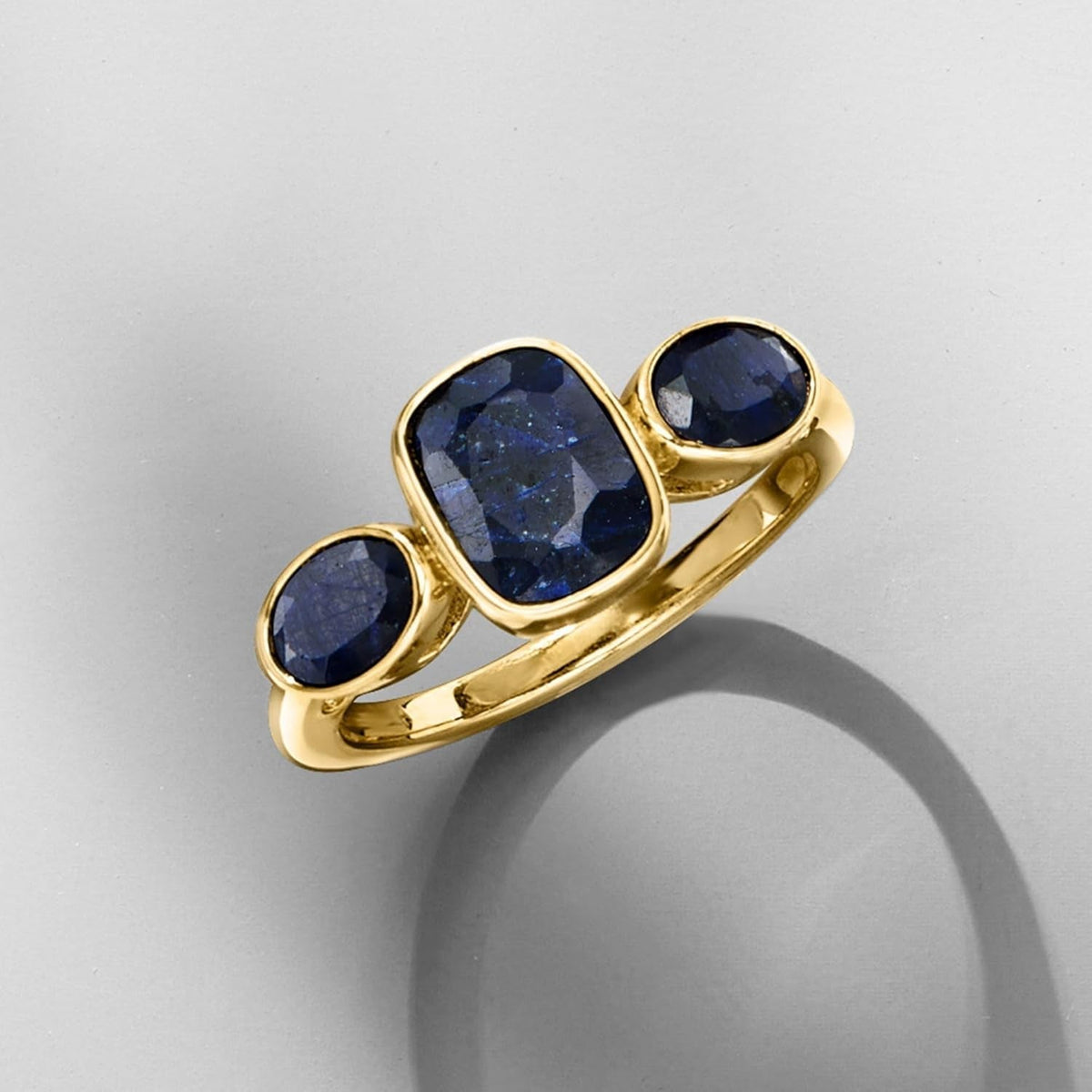 3.30 Ct. T.W. Sapphire 3-Stone Ring in 18Kt Gold over Sterling. Size 7