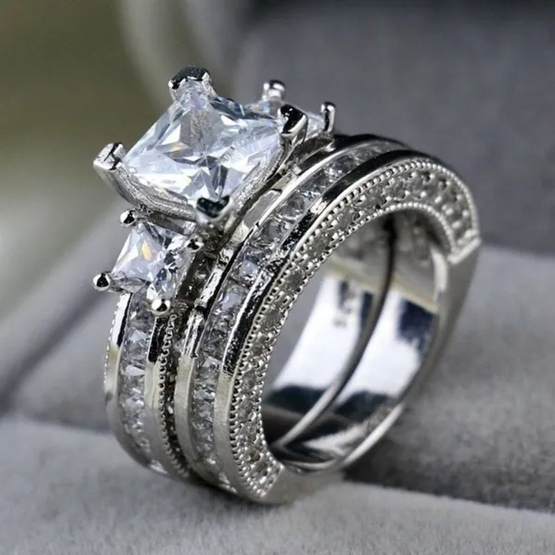 YOHAPP NEW Fashion Couple Rings Set Jewelry - Men's 8mm 316L Stainless Steel Titanium Ring and Women's Three Stone Princess Cut 1CT Diamond   Silver  Bridal Wedding Engagement Band Ring