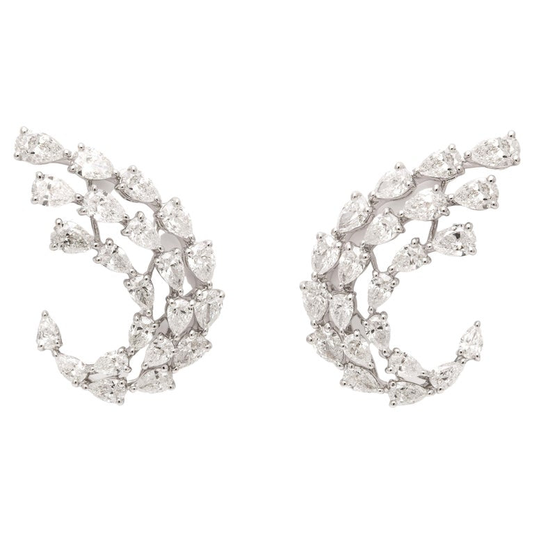 https://a.1stdibscdn.com/diamond-swirl-earrings-for-sale/j_415/j_155244021650563373178/j_15524402_1650563374436_bg_processed.jpg?width=768